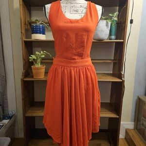 Louche Size 14 L reddish orange flirty hi- low dress. Strappy